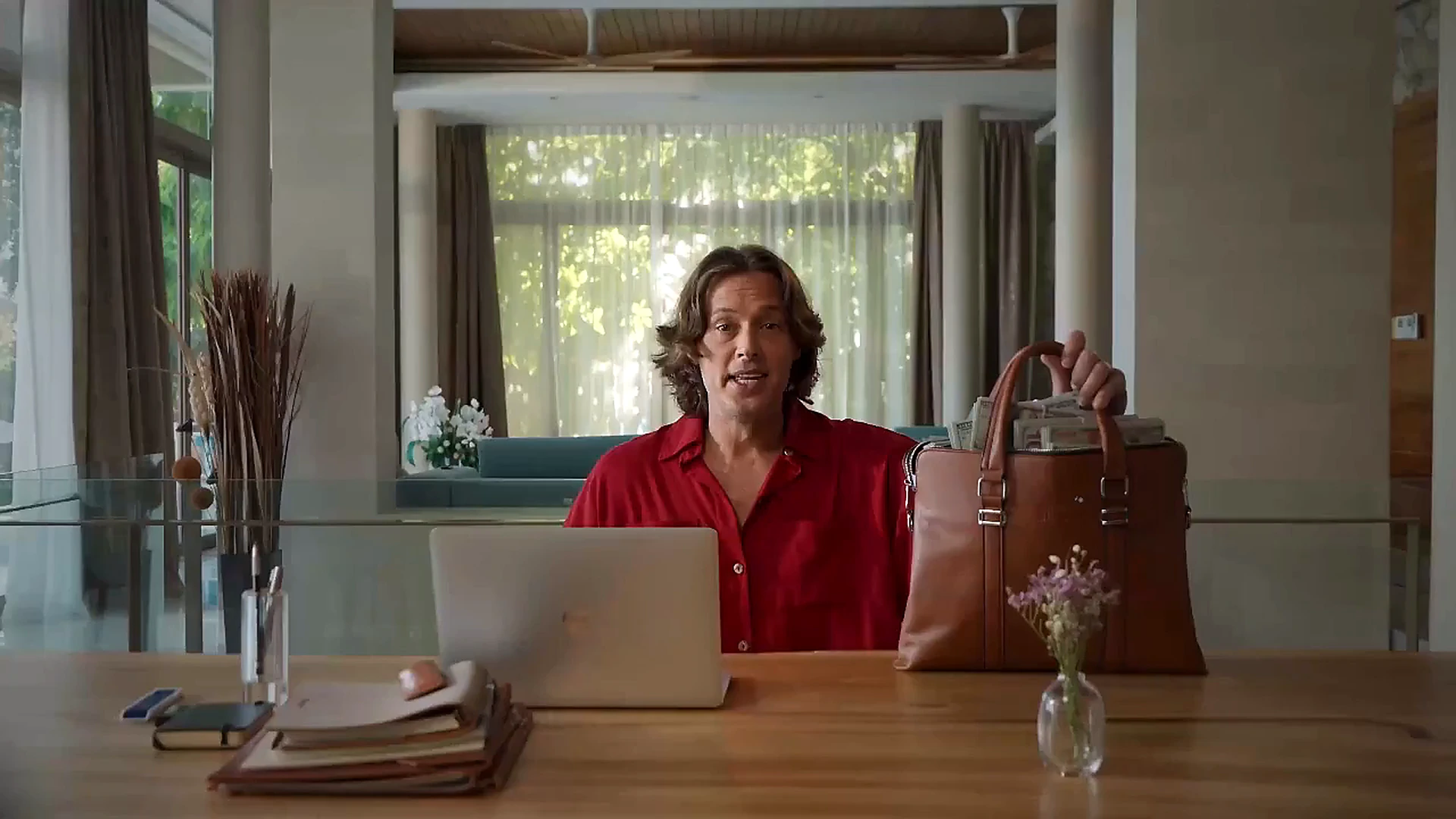 FinAI brand video frame showing a presenter in a professional setting